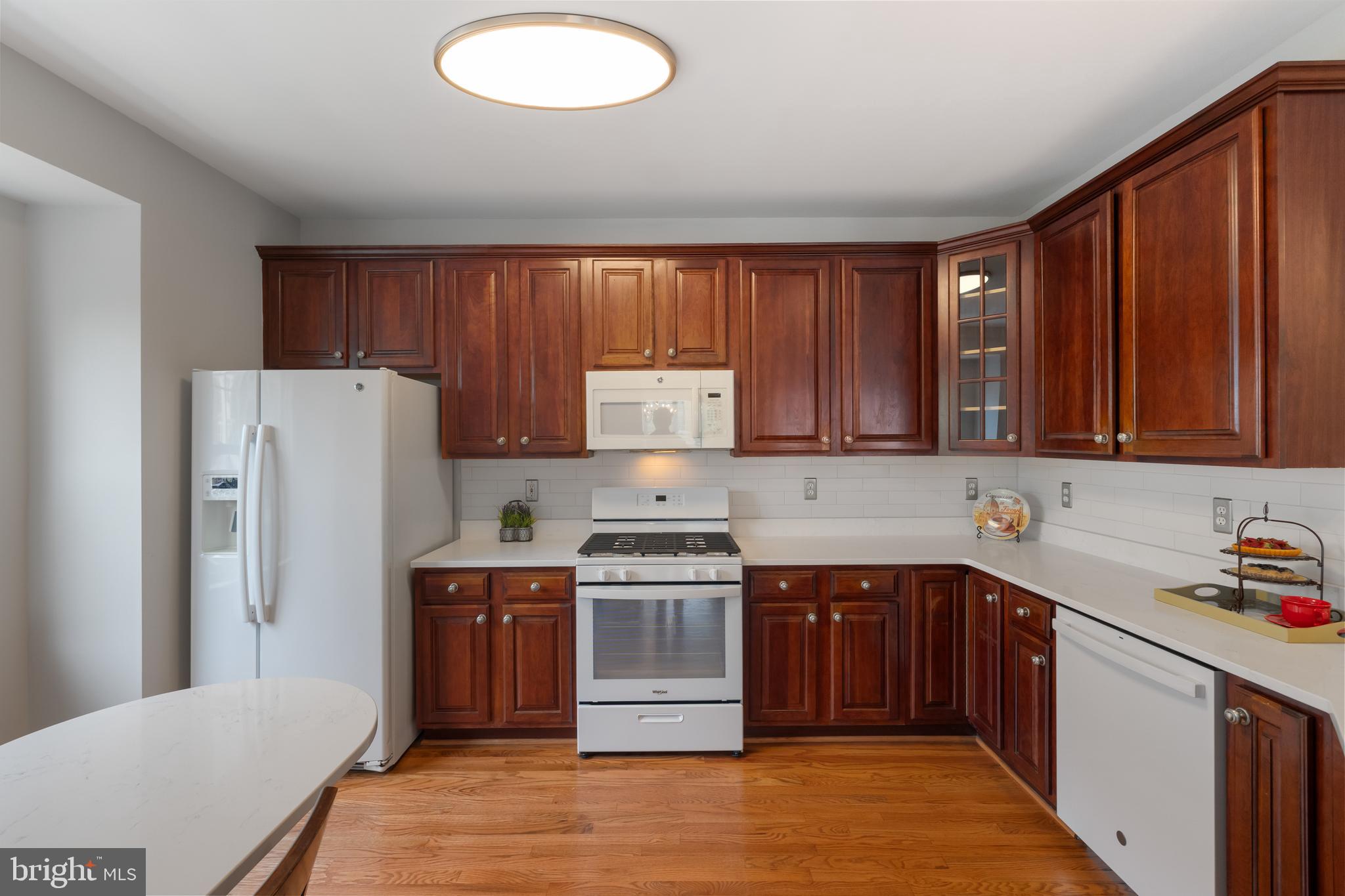 5117 Grimm Drive Alexandria, VA 22304 - Photo 14 of 67 a kitchen with a stove sink and cabinets
