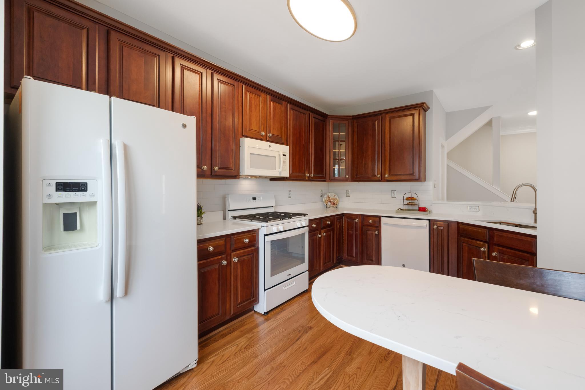 5117 Grimm Drive Alexandria, VA 22304 - Photo 15 of 67 a kitchen with stainless steel appliances a refrigerator and a sink