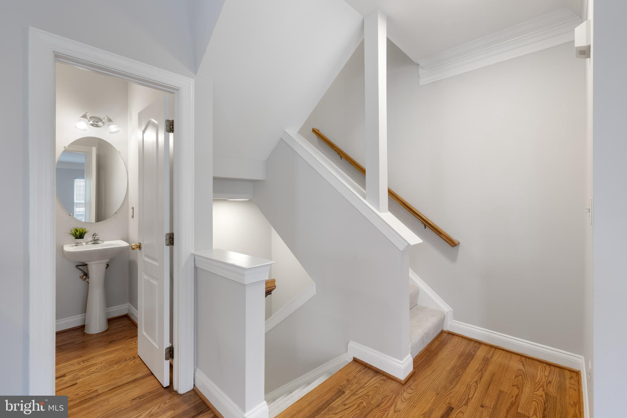 5117 Grimm Drive Alexandria, VA 22304 - Photo 22 of 67 a view of a hallway with wooden floor and entryway