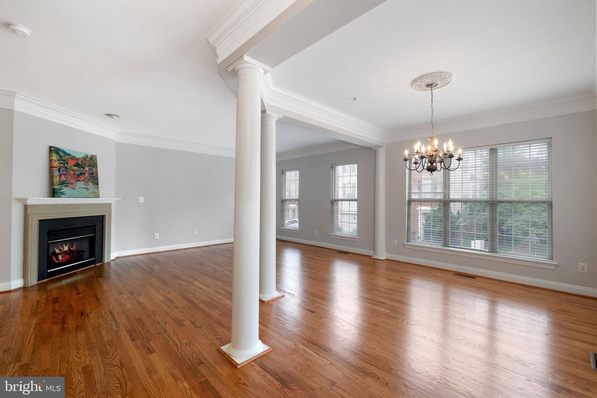 5117 Grimm Drive Alexandria, VA 22304 - Photo 7 of 67 a view of an empty room with wooden floor fireplace and a window