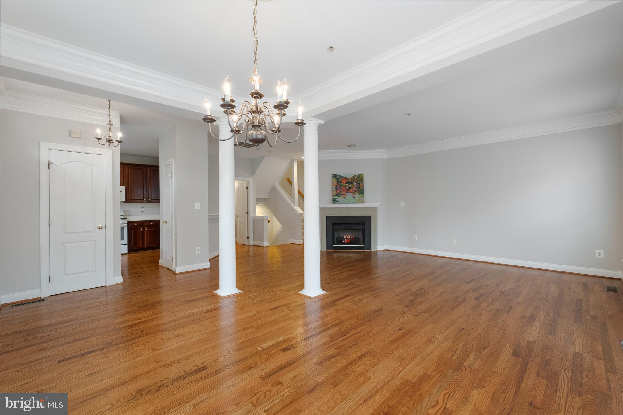 5117 Grimm Drive Alexandria, VA 22304 - Photo 8 of 67 a view of a livingroom with wooden floor and a ceiling fan