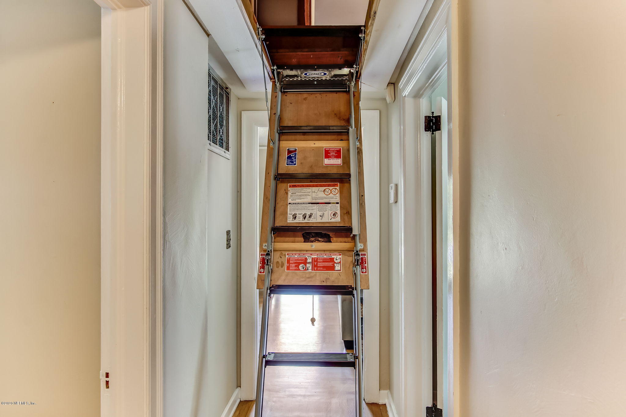 2164 Huntsford Road Jacksonville, FL 32207 - Photo 23 of 34 a view of a hallway with wooden door