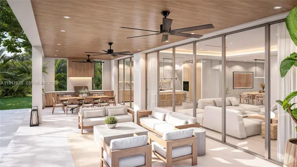 a living room with furniture and floor to ceiling windows