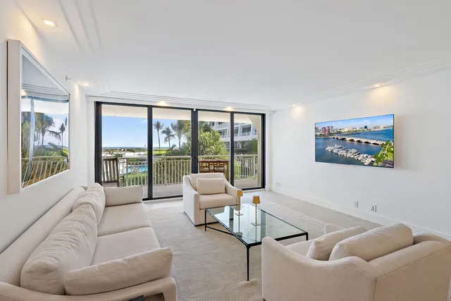 a bedroom with a large bed and a large window