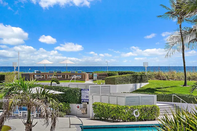 a kitchen with sink white cabinets and stove