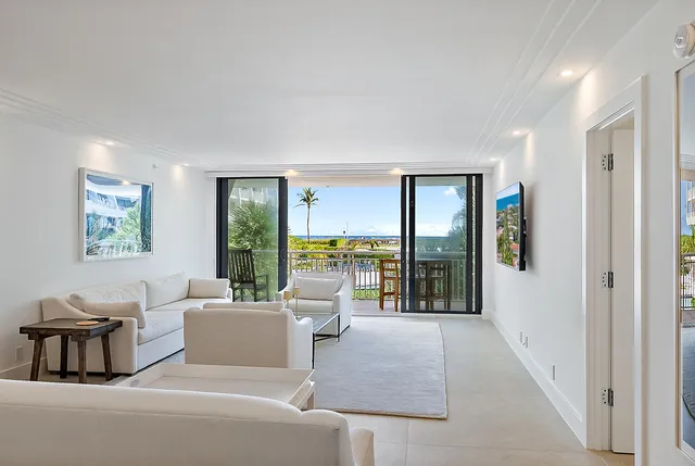 a view of swimming pool with a garden and patio