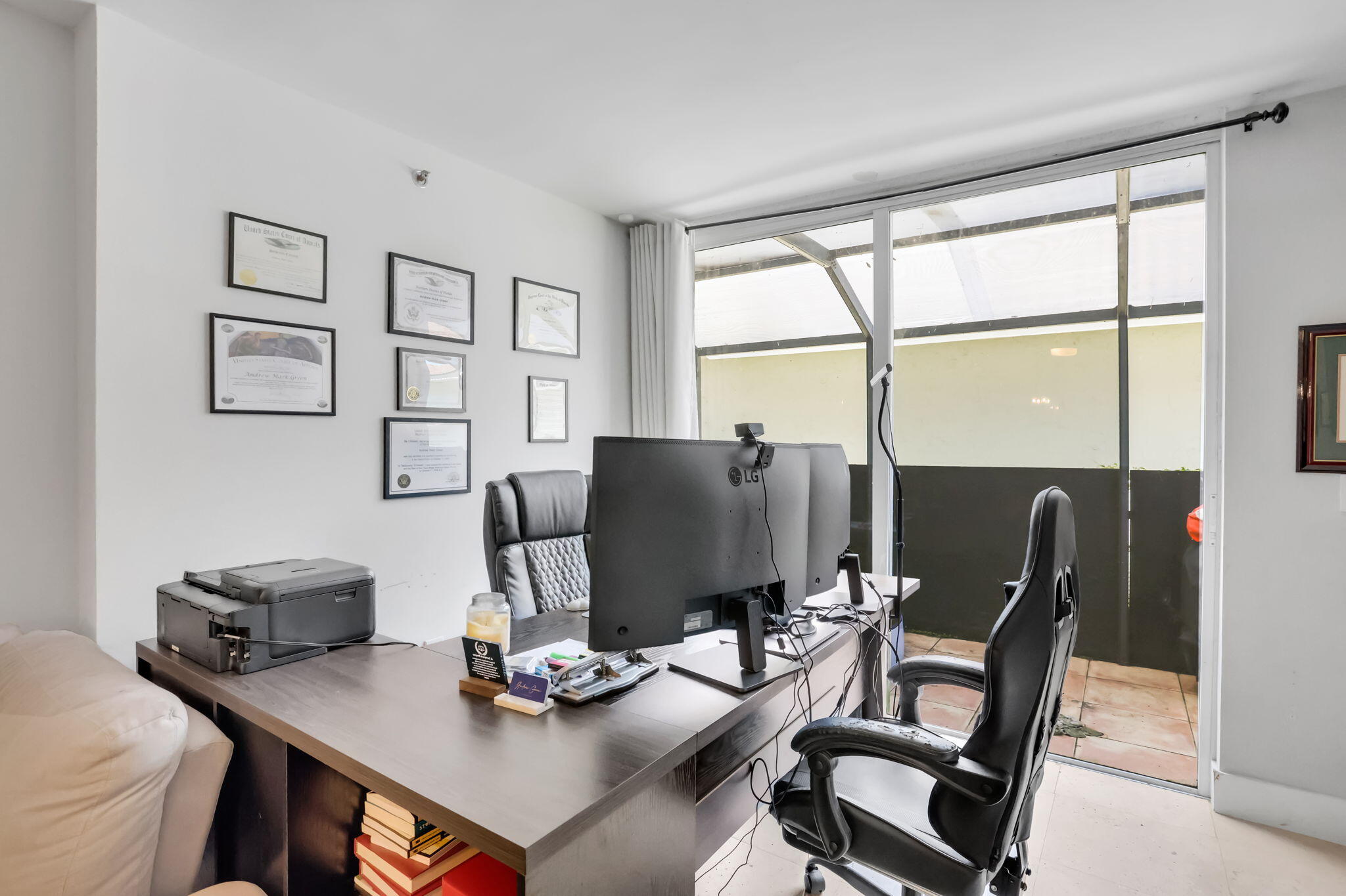 3237 Clint Moore Road, Unit 103 Boca Raton, FL 33496 - Photo 4 of 13 a view of a workspace with furniture and a window