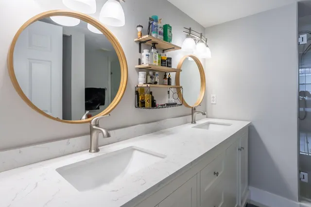 a bathroom with a sink and a mirror