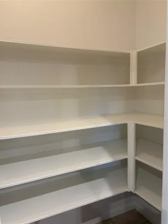 a view of a room with racks on the wall