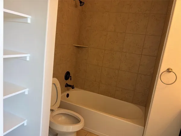 a bathroom with a bathtub and a sink