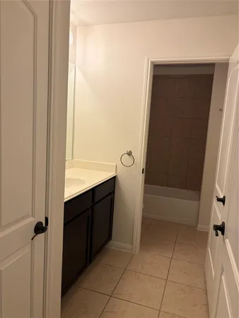 a toilet sitting in a bathroom next to a sink