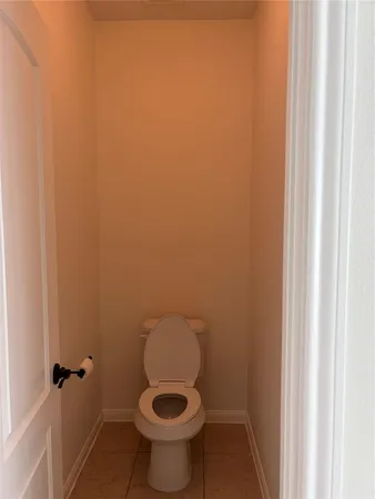 a bathroom with a toilet and a bathtub