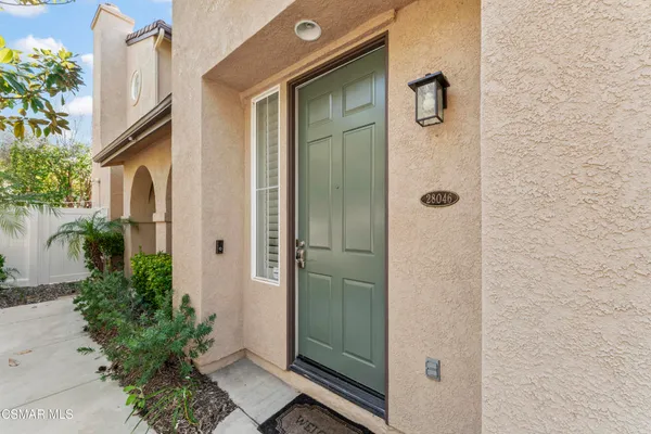 a bathroom with a shower and a mirror