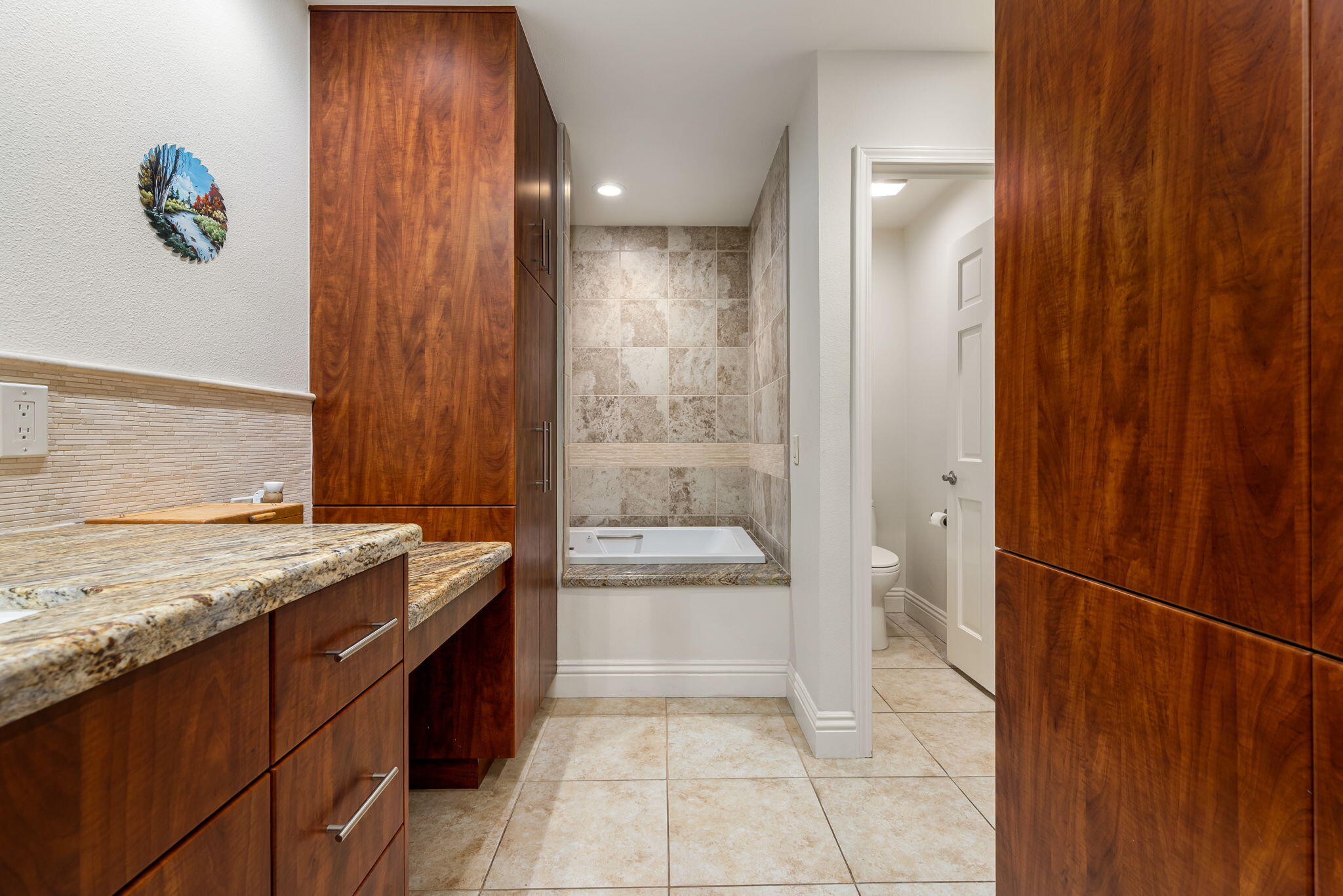 45740 Pueblo Road Indian Wells, CA 92210 - Photo 38 of 61 a bathroom with a granite countertop sink a toilet and shower