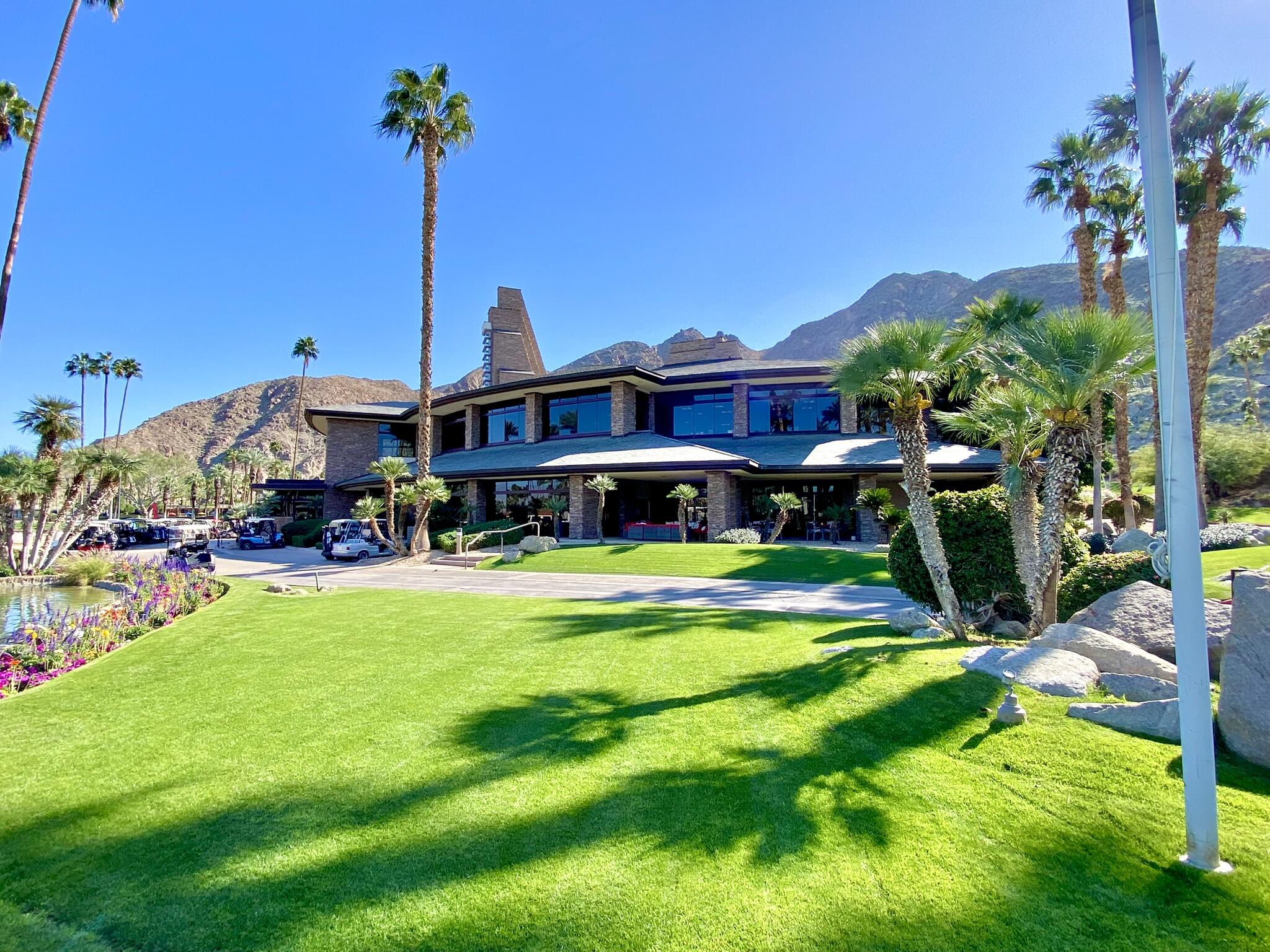 45740 Pueblo Road Indian Wells, CA 92210 - Photo 56 of 61 a view of a house with a big yard and potted plants