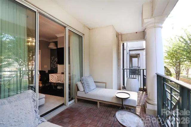a living room with furniture and a toilet