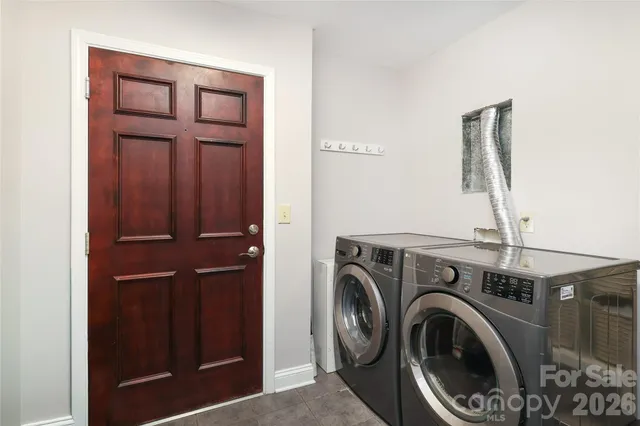 a view of storage and utility room with washer and dryer