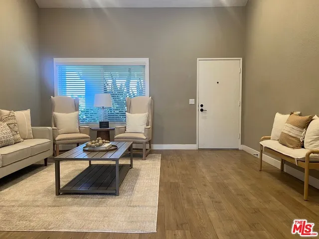 a living room with furniture and a table