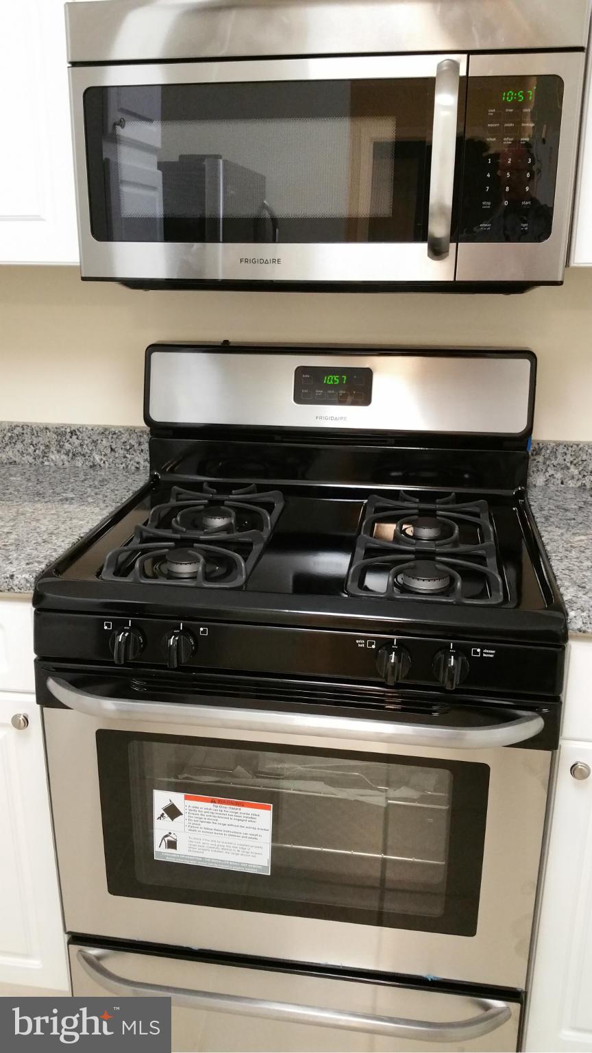5575 Seminary Road, Unit 311 Falls Church, VA 22041 - Photo 26 of 30 a stove top oven sitting inside of a kitchen