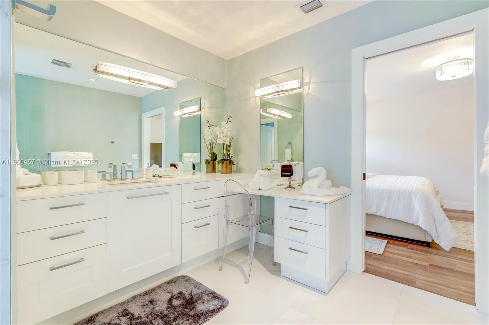 555 Southwest 27th Road Miami, FL 33129 - Photo 15 of 26 a spacious bathroom with a double vanity sink mirror and