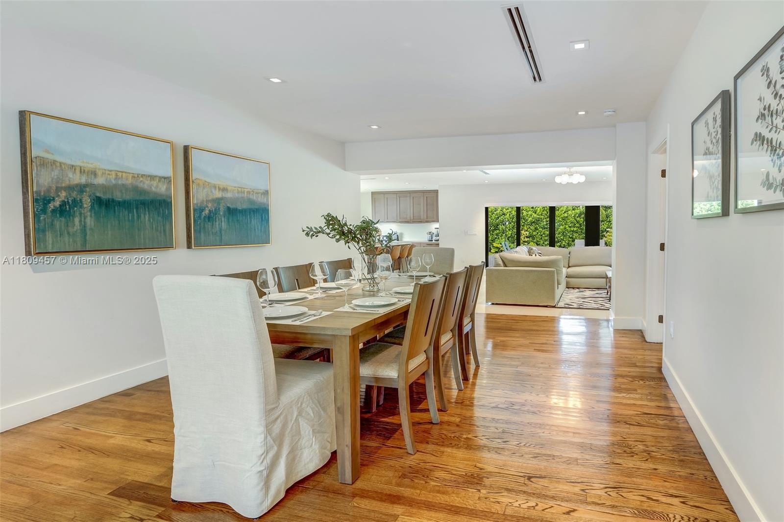 555 Southwest 27th Road Miami, FL 33129 - Photo 7 of 26 a view of a dining room with furniture window and wooden floor