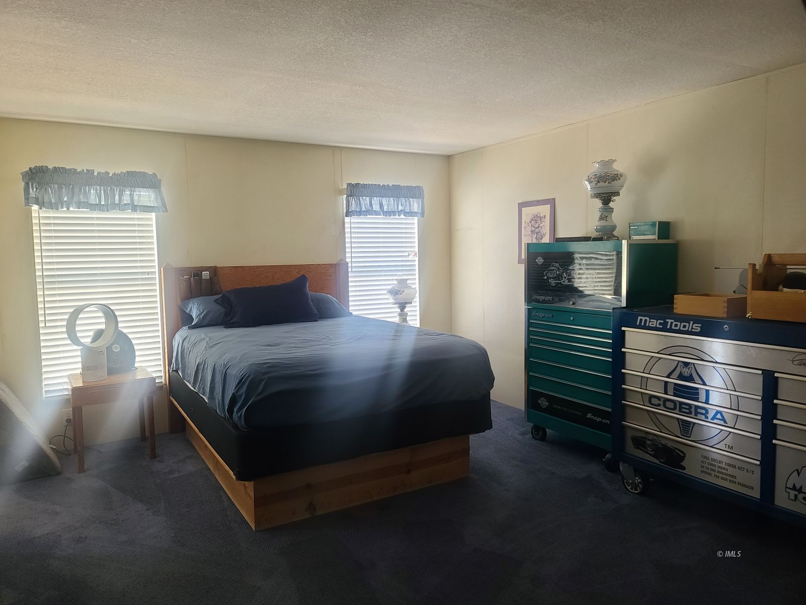 37 Sequoia Street Bishop, CA 93514 - Photo 11 of 16 a bedroom with a bed and dresser with window