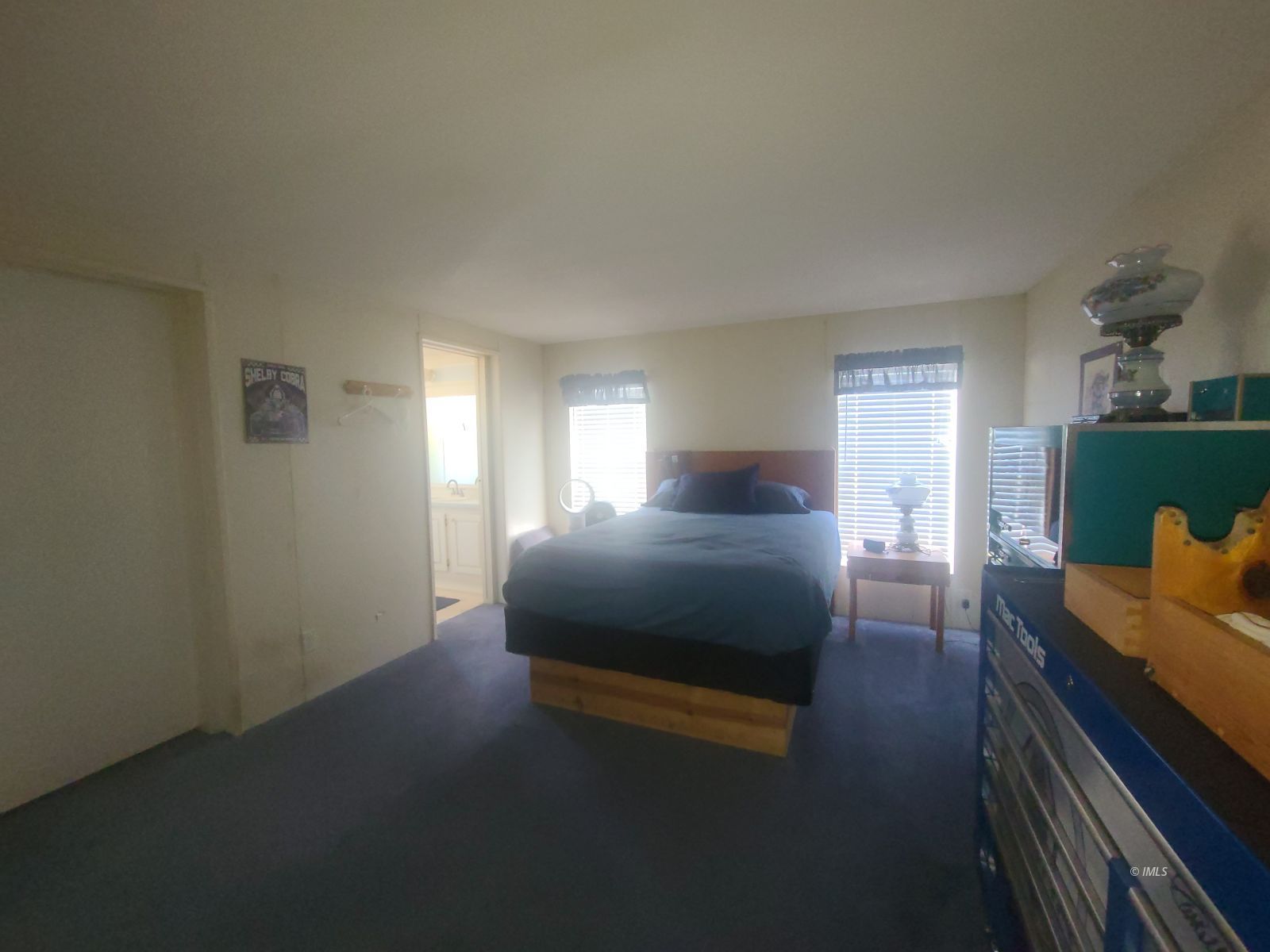 37 Sequoia Street Bishop, CA 93514 - Photo 12 of 16 a bedroom with a bed and a window