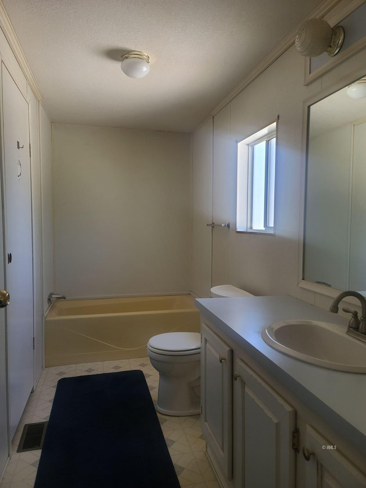 37 Sequoia Street Bishop, CA 93514 - Photo 13 of 16 a bathroom with a sink a toilet and tub