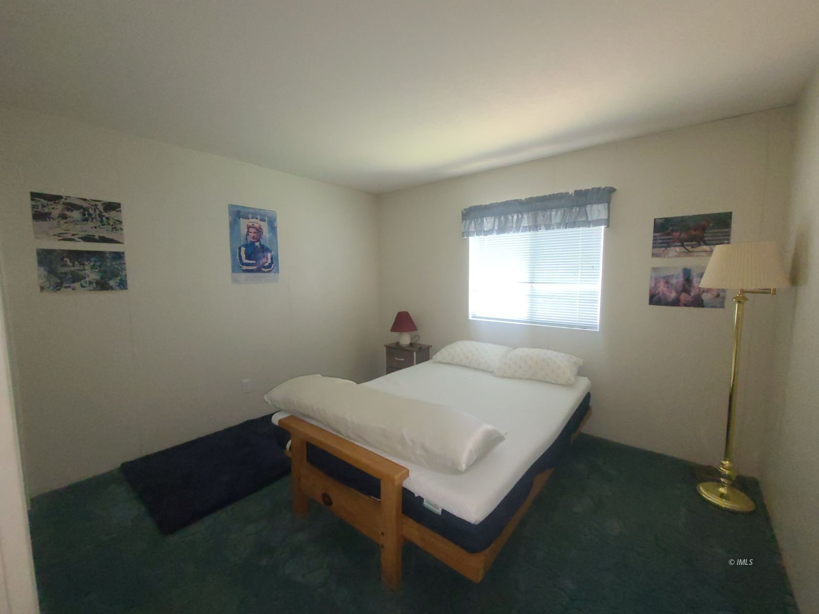 37 Sequoia Street Bishop, CA 93514 - Photo 7 of 16 a bed sitting in a bedroom next to a window