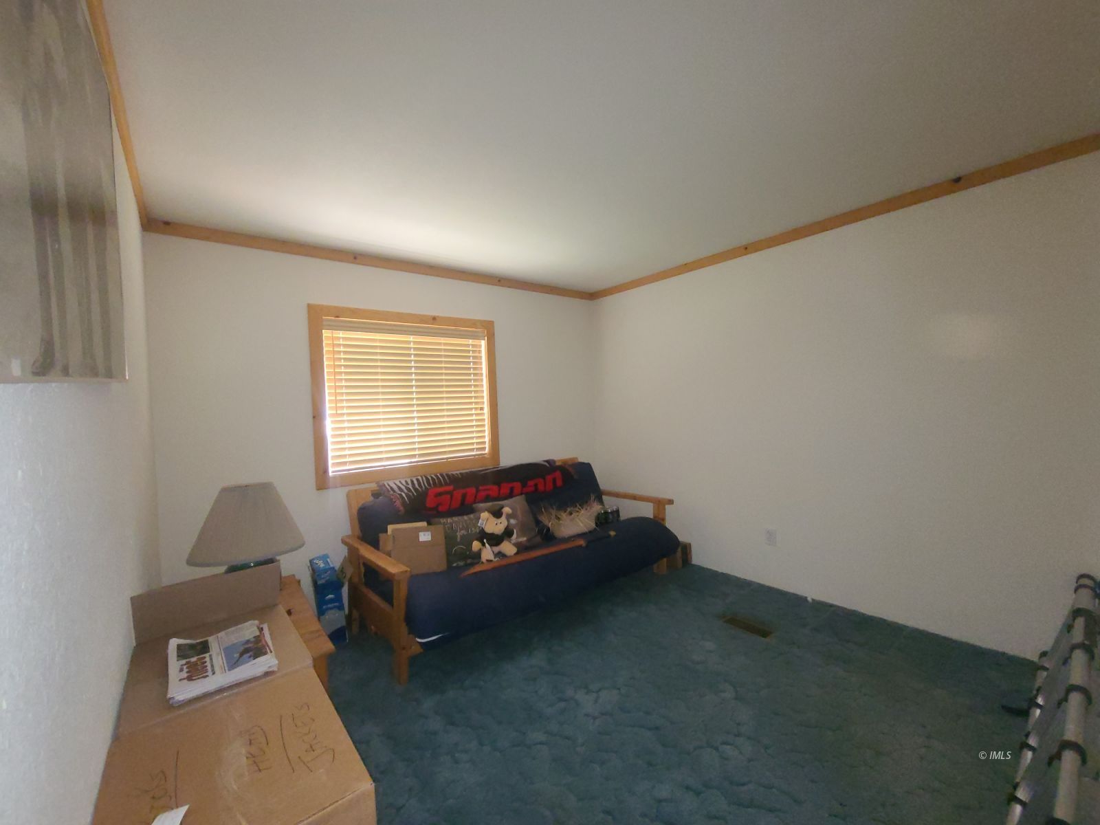 37 Sequoia Street Bishop, CA 93514 - Photo 9 of 16 a living room with a couch and a window