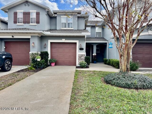 8852 Inlet Bluff Drive Jacksonville, FL 32216 - Photo 1 of 53 a front view of a house with a yard