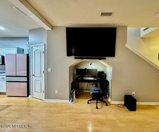 8852 Inlet Bluff Drive Jacksonville, FL 32216 - Photo 12 of 53 a room with furniture and a flat screen tv