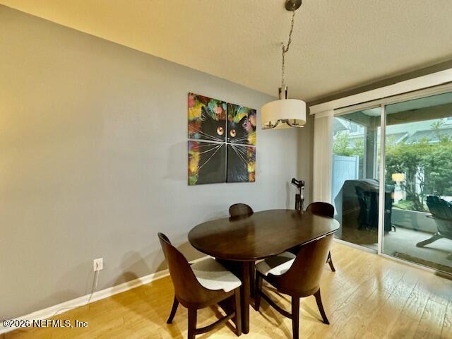 8852 Inlet Bluff Drive Jacksonville, FL 32216 - Photo 15 of 53 a dining room with furniture and window