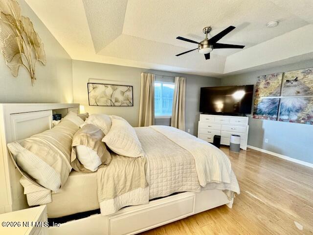 8852 Inlet Bluff Drive Jacksonville, FL 32216 - Photo 24 of 53 a bedroom with a bed and a flat screen tv