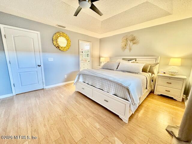 8852 Inlet Bluff Drive Jacksonville, FL 32216 - Photo 26 of 53 a bedroom with a bed and painting on the wall