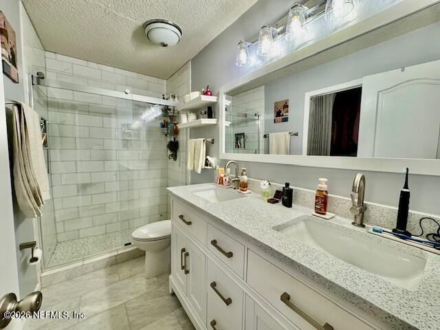 8852 Inlet Bluff Drive Jacksonville, FL 32216 - Photo 28 of 53 a bathroom with a granite countertop double vanity sink mirror and shower