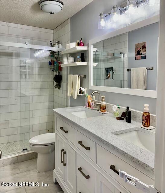 8852 Inlet Bluff Drive Jacksonville, FL 32216 - Photo 29 of 53 a bathroom with a granite countertop sink a toilet and shower