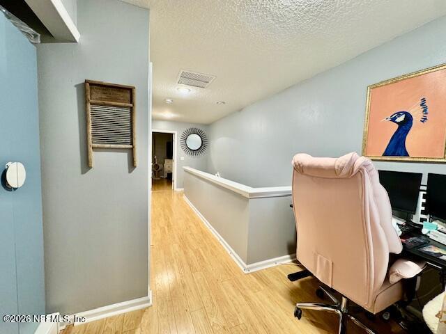 8852 Inlet Bluff Drive Jacksonville, FL 32216 - Photo 32 of 53 a workspace with furniture and wooden floor