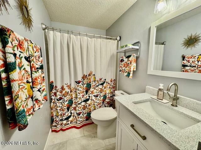 8852 Inlet Bluff Drive Jacksonville, FL 32216 - Photo 37 of 53 a bathroom with a granite countertop sink and a toilet