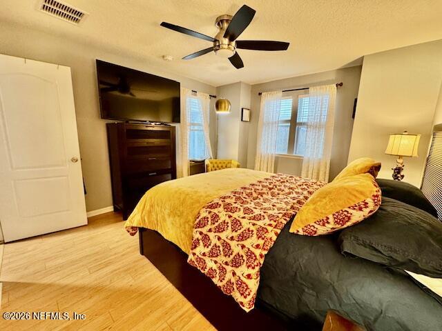 8852 Inlet Bluff Drive Jacksonville, FL 32216 - Photo 40 of 53 a bed sitting in a bedroom and a flat tv screen