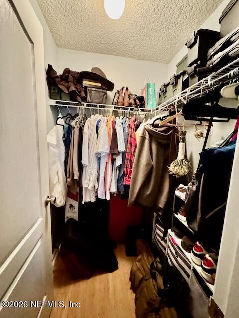 8852 Inlet Bluff Drive Jacksonville, FL 32216 - Photo 41 of 53 a view of walk in closet with clothes and shoes