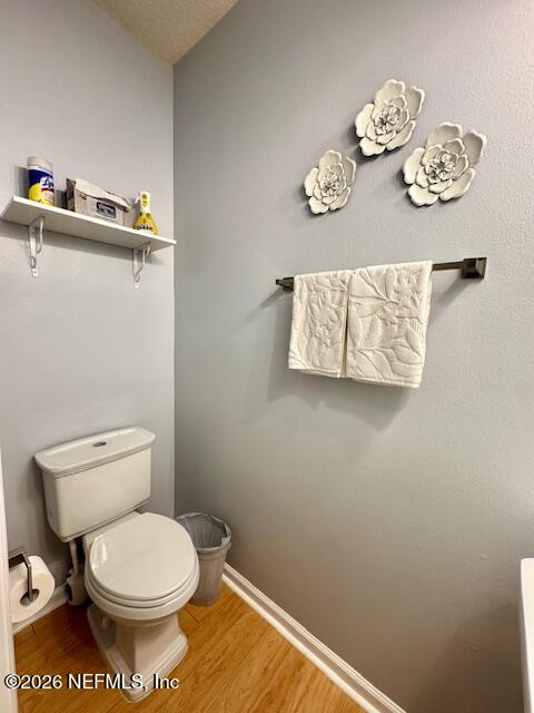 8852 Inlet Bluff Drive Jacksonville, FL 32216 - Photo 5 of 53 a bathroom with a toilet and a sink