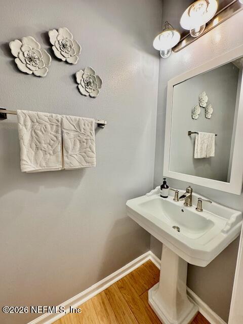 8852 Inlet Bluff Drive Jacksonville, FL 32216 - Photo 6 of 53 a bathroom with a sink a mirror and a lamp