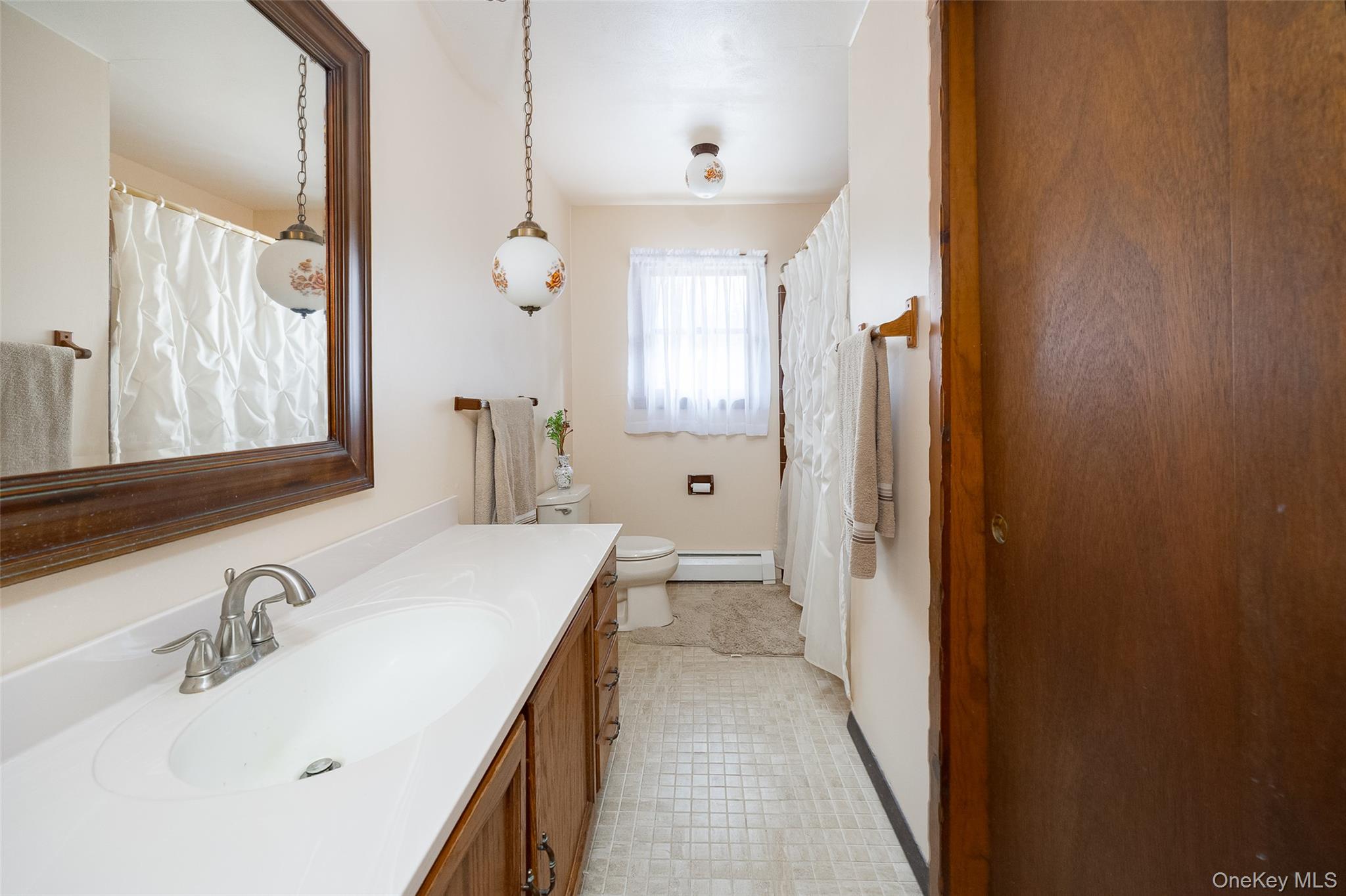 4 Kilmer Road Hyde Park, NY 12538 - Photo 16 of 36 a bathroom with a sink and a mirror