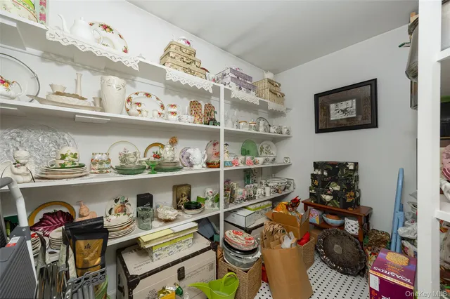 a kitchen with stainless steel appliances a rug and a wooden floor