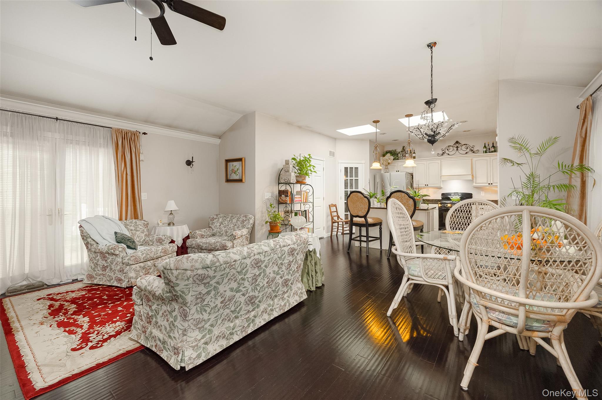 4 Kilmer Road Hyde Park, NY 12538 - Photo 27 of 36 a living room with furniture and a chandelier