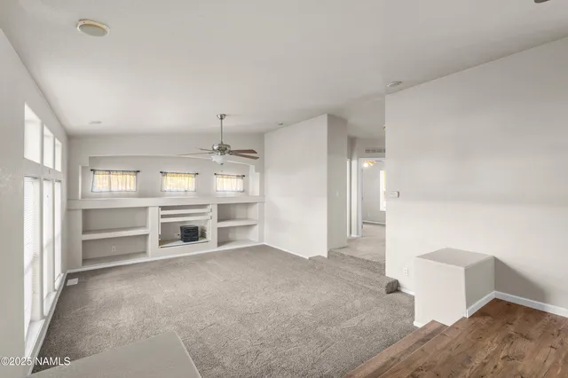 a view of a room with cabinet and mirrors