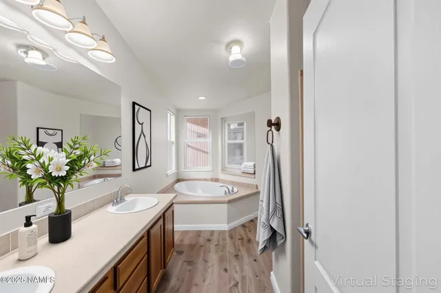 a dining room with furniture a potted plant and a sink