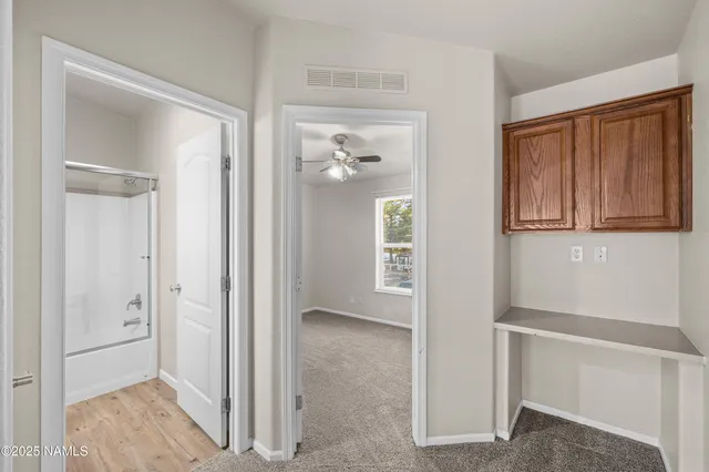 a bathroom with a sink a mirror and a shower