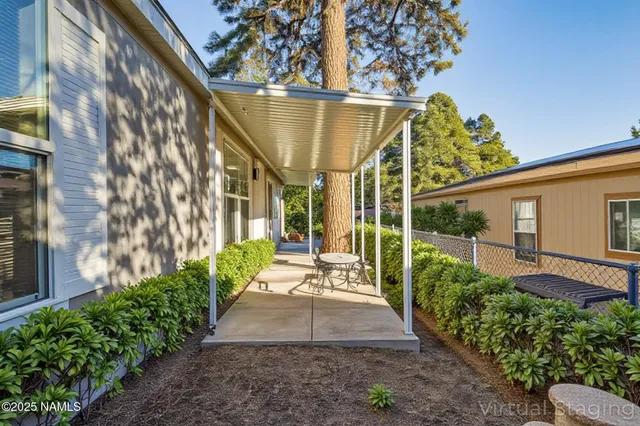 a view of a backyard with pathway